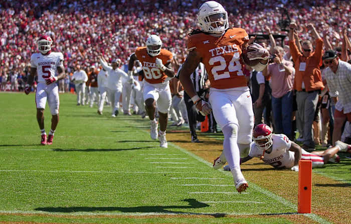 Texas Longhorns running back Jonathon Brooks (24) scores a touchdown late in the fourth quarter against Oklahoma Sooners during an NCAA college football game at the Cotton Bowl on Saturday, Oct. 7, 2023